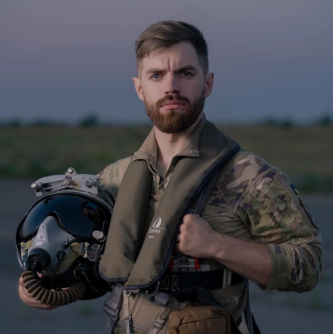 Andrii Pilshchykov holding his flight helmet